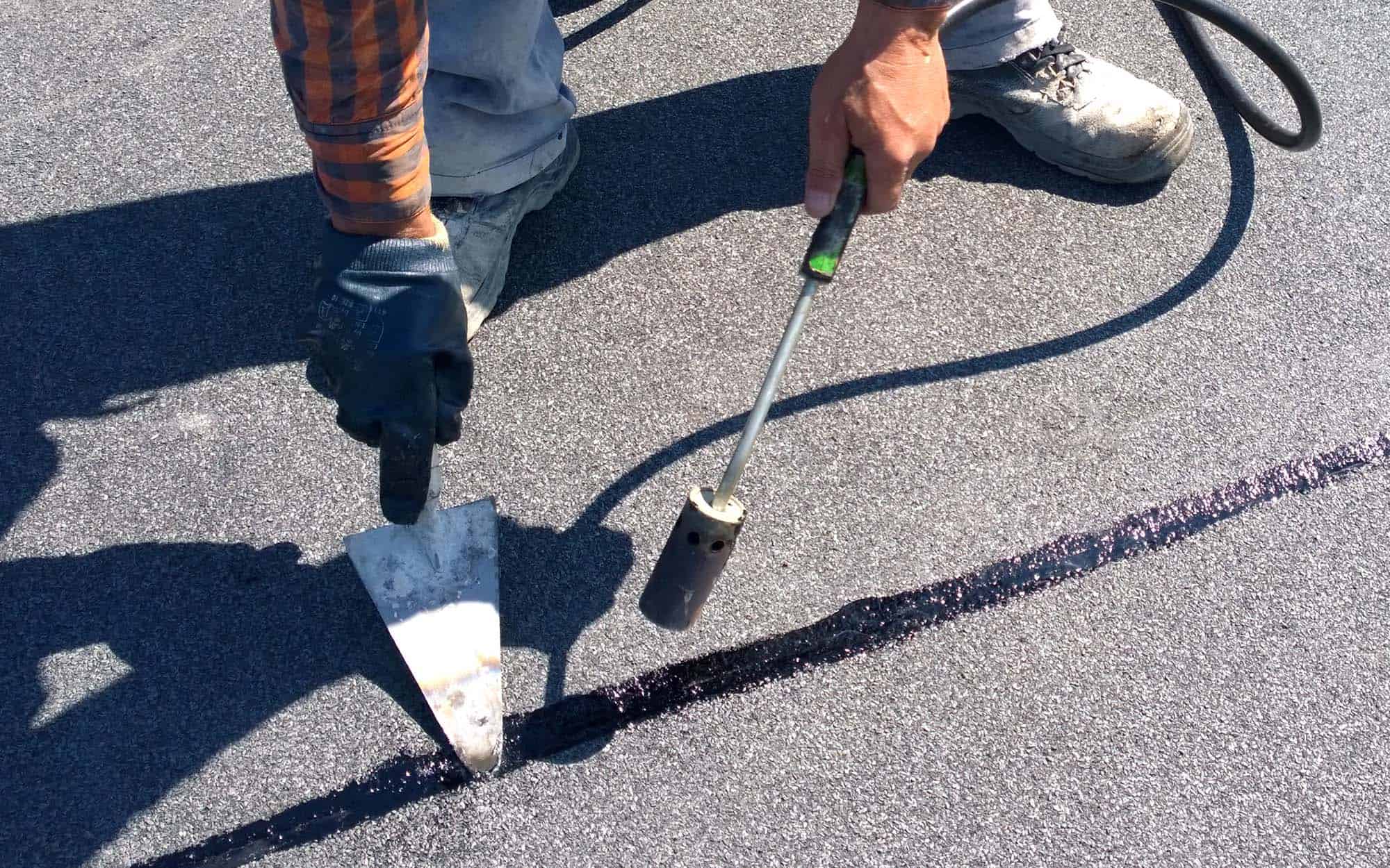 Close-up-view-of-a-person-using-heat-gun-to-seal-epdm-1